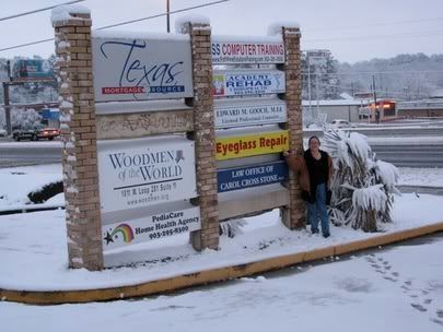 Me pointing to our office sign